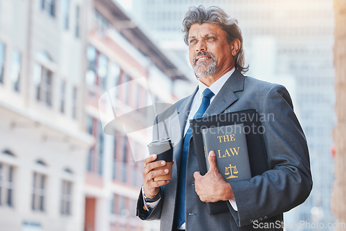 Image of Lawyer, man with a book and thinking in the city with idea on law, policy or research with legal books and knowledge of rules. Attorney, judge or man with advice in court or working in justice