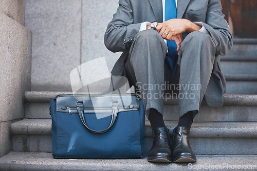 Image of Lawyer, briefcase and man shoes on city and urban steps of government building outdoor. Businessman, justice and luggage for professional work of employee on a break of legal career of a attorney