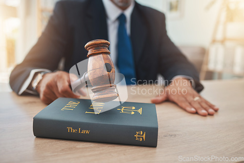 Image of Book, judge and gavel with hands of man in office for lawyer, justice and legal hearing. Attorney, advocate and crime with closeup of person law firm for courtroom, knowledge and jury guide