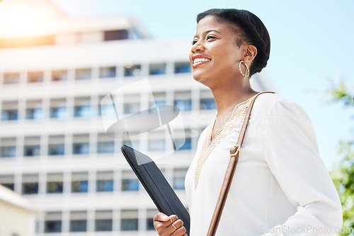 Image of Happy, smile and businesswoman walking in the city with a digital tablet to her office building. Confidence, happiness and African female lawyer with technology commuting to work in an urban town.