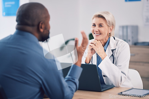 Image of Doctor, people and office consultation, talking and healthcare services, clinic support and advice with laptop. Medical professional, mature woman and patient consulting for insurance or information