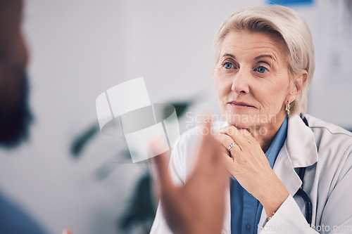 Image of Face of woman, doctor and listening in consultation for healthcare advice, clinic support or help. Mature medical professional, focus and consulting patient in hospital for feedback, trust or service