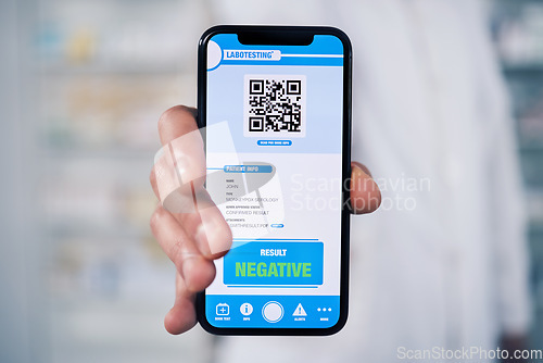 Image of Doctor, hands and phone with QR code for diagnosis, healthcare results or screening at pharmacy. Closeup of person, pharmacist or medical expert show mobile smartphone app, monkeypox or negative test