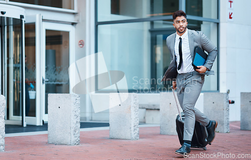 Image of Businessman outside office, suitcase and running for travel rush, lawyer at law firm for work commute. Folder, luggage and business man on sidewalk, attorney with hurry on city street and late to job