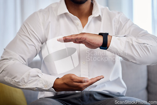 Image of Hands, mockup and product with a business man sitting on the sofa in an office to offer insurance or cover. Advertising, marketing and size with a male employee holding space for a brand or logo