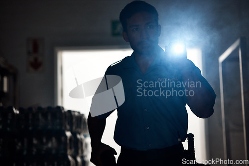 Image of Flashlight, police and man in dark for investigation, inspection and property search at night. Surveillance, law and security male person with torch in room for safety, crime and protection service