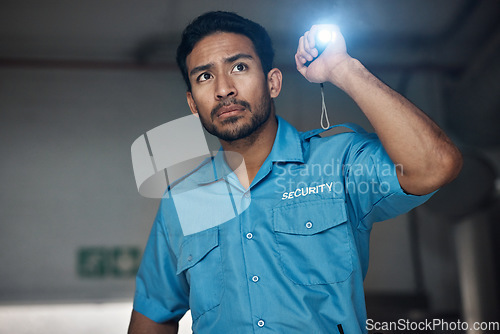 Image of Police, search and man with flashlight for investigation, inspection and property patrol at night. Surveillance, law and security male person in dark room for safety, crime and protection service