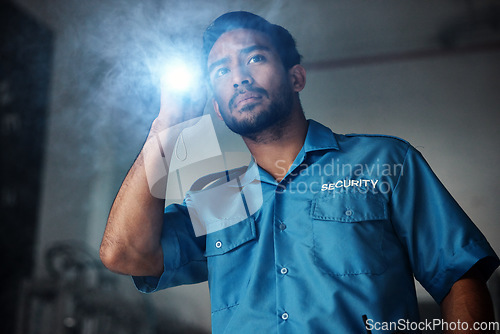 Image of Torch, security and man at night for investigation, inspection or property search in dark room. Surveillance, law and police male person with flashlight for safety, crime guard and protection service