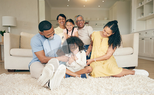 Image of Happy, family and home with fun and tickle with mother, grandparents and children together. Parent relax, dad love and support with kids on a lounge sofa in a house with a smile in a living room