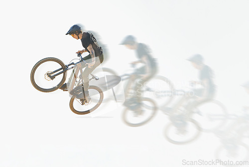 Image of Bicycle, trick or man riding in the air with speed, motion or overlay of cycling, jump or person training to do a crazy stunt. Cyclist, adrenaline and double exposure of parkour, sports or cycling