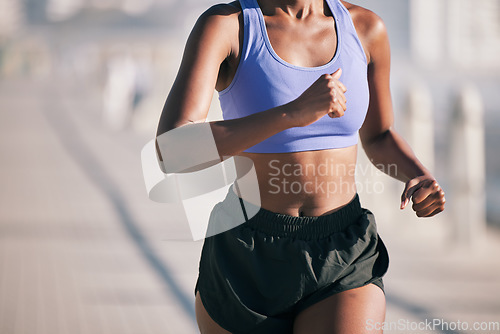 Image of Closeup, woman and body running outdoor in sun for marathon race, sports performance and fitness. Female runner, cardio training and healthy summer workout for energy, fast action and urban exercise