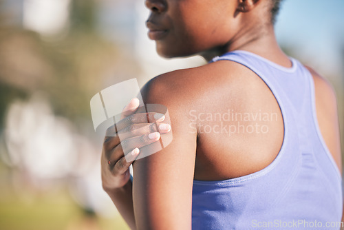 Image of Arm, pain and woman with injury in outdoor for training accident from sport with exercise or body. Runner, shoulder and muscle strain with female athlete after workout at park for cardio or wellness.