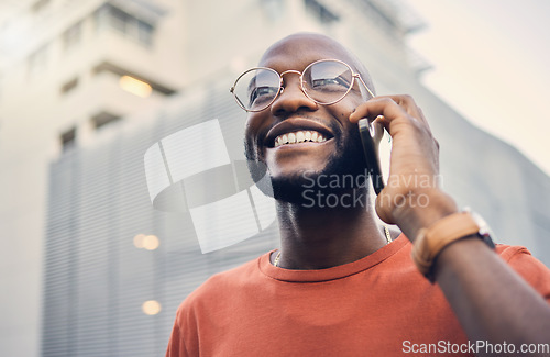 Image of .Black man, smile and phone call outdoor on a city street with a positive mindset and confidence. Face of a happy african person with glasses on an urban road with a smartphone for communication.