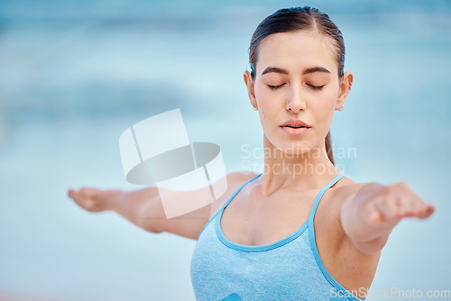 Image of Fitness, yoga and woman for balance by beach for wellness, healthy body and energy. Sports, nature and face of female person with eyes closed to focus for exercise, training and workout by ocean