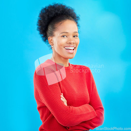 Image of Happy, smile and portrait of a woman with style and confident isolated in a studio blue background. Casual, outfit and full body of a young female person with stylish, fashion and trendy clothes