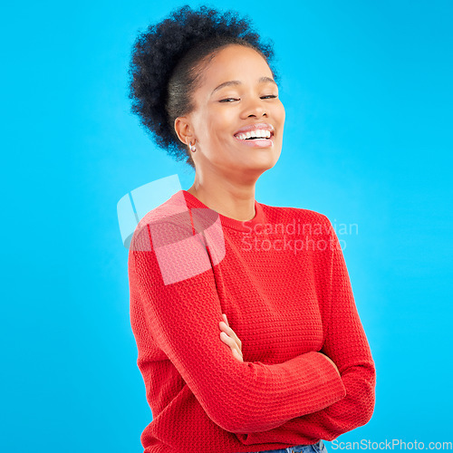 Image of Laughing, smile and portrait of a woman with style and confident isolated in a studio blue background. Casual, outfit and full body of a happy young female person with stylish or trendy clothes