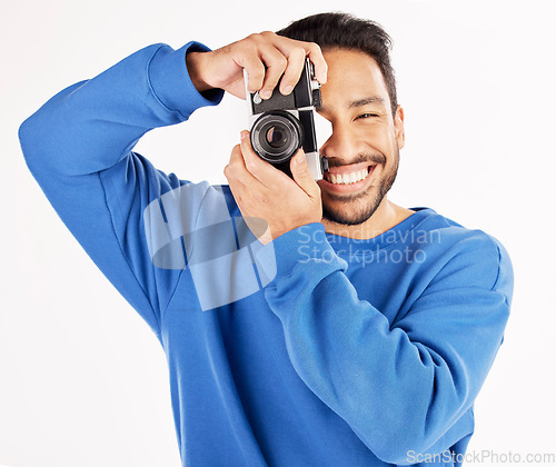 Image of Camera, photographer and portrait of asian man in studio for photoshoot, creativity and paparazzi. Happy journalist, photography and shooting with vintage equipment for production on white background