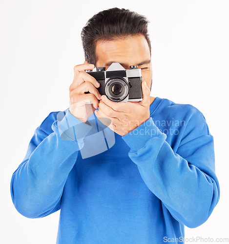 Image of Retro camera, photography and man in studio for photoshoot, creative media and paparazzi. Male photographer, journalist and shooting with vintage equipment for production, lens and white background