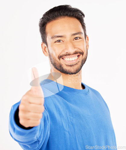 Image of Thumbs up, portrait and asian man in support, success and winning news in studio. Face of happy model, thumb emoji and like of feedback, good review or vote in agreement of winner on white background