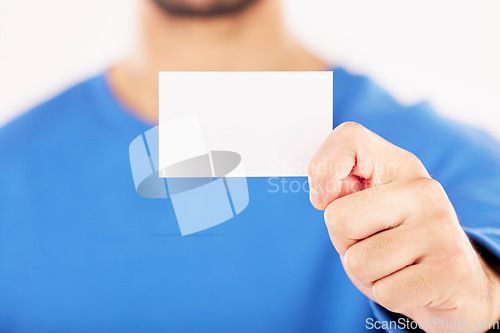 Image of Mockup, business card and hands in studio for advertising, branding about us or information sign. Closeup of person show space on paper for promotion, contact note or announcement on white background