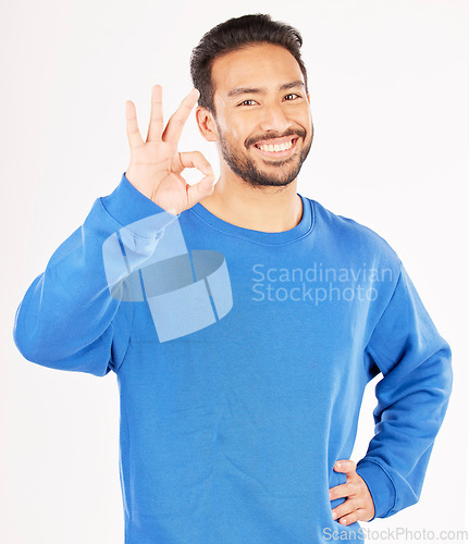 Image of Okay hands, portrait and asian man in studio, isolated white background and vote of good review. Male model, smile and ok for success, agreement and icon for support, yes emoji and thank you sign