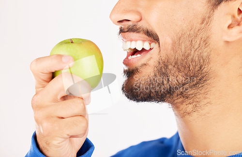 Image of Closeup, man and hands with apple for diet, natural nutrition or vitamin against a white studio background. Mouth of male person eating healthy organic fruit or bite for wellness, detox or fiber