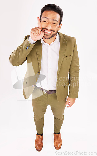 Image of Smile, excited and businessman pointing up at promotion deal isolated in a white studio background for a sale. Promo, branding and happy employee or worker showing advertising product placement