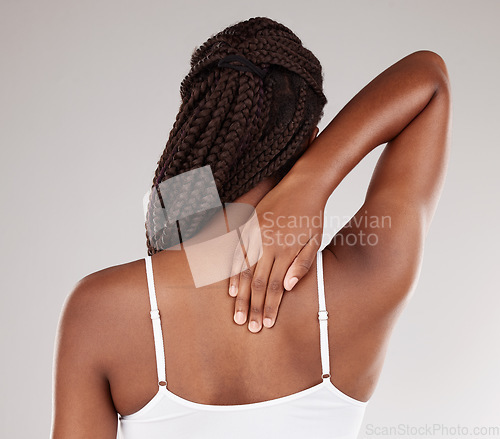 Image of Studio, hand or black woman with back pain isolated on a white background after accident emergency. Injury, muscle tension or person with body ache with joint strain, sore or swollen with stress