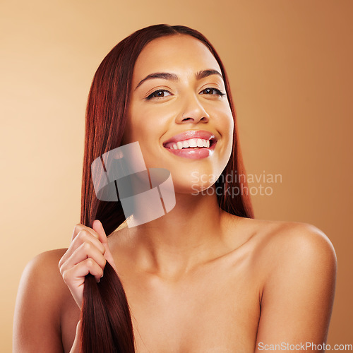 Image of Smile, beauty and portrait of woman with strong hair in hand, luxury salon treatment and brown background. Natural glow, haircut and haircare, happy face of model with cosmetics and makeup in studio.