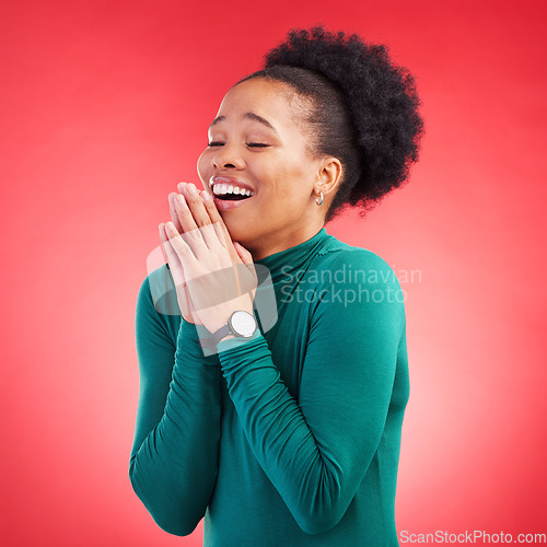 Image of Thank you, praying and black woman in studio happy, relief and grateful against red background. Blessing, gratitude and African female smile for good news, outcome or results, solution or answer