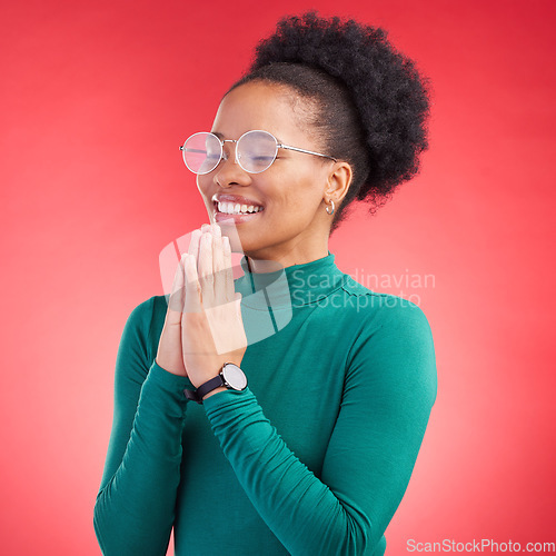 Image of Prayer, thank you and black woman in studio happy, relief and faith and hope on a red background. Blessing, gratitude and African person smile for good news, outcome or results, solution or answer