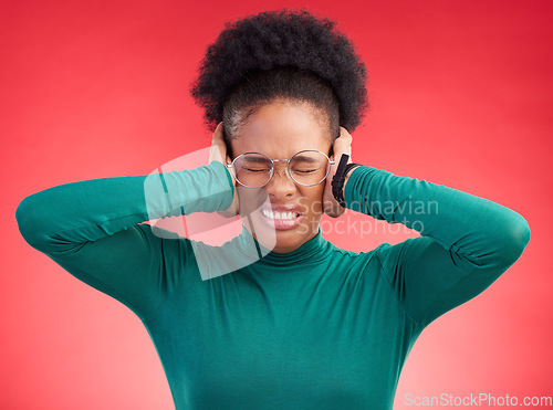 Image of Stress, headache and hands on ears of black woman in studio with noise, complaint or frustration on red background. Migraine, anxiety and African female with vertigo, brain fog or hearing loss crisis
