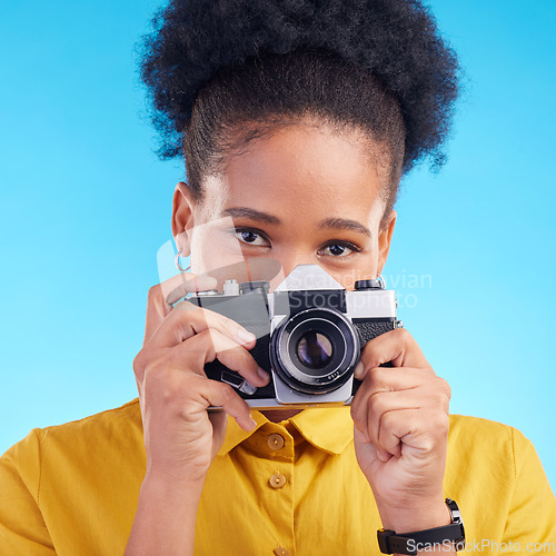 Image of Photographer, portrait and camera, black woman isolated on blue background, creative artist job talent. Art, face of happy girl in photography hobby or career in studio on travel holiday photoshoot.