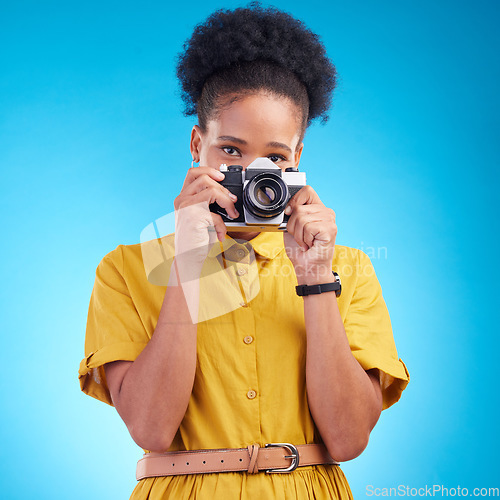 Image of Photography, portrait and black woman with camera isolated on blue background, creative artist job talent. Art, face of happy photographer with hobby or career in studio on travel holiday photoshoot.