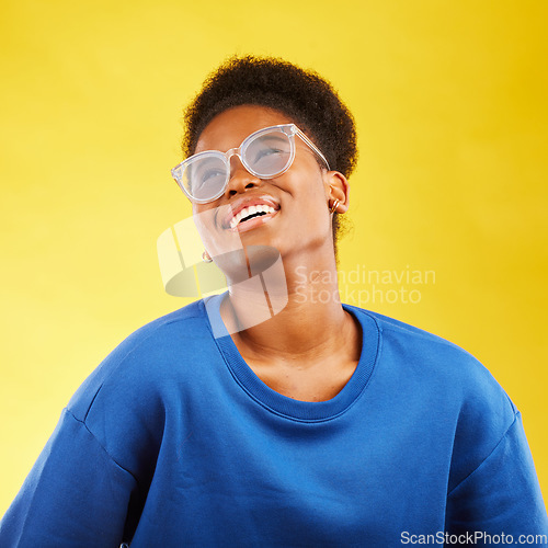 Image of Happy, fashion and glasses with face of black woman in studio for vision, eye care and trendy style. Gen z, smile and happiness with female person on yellow background for expert, health and idea