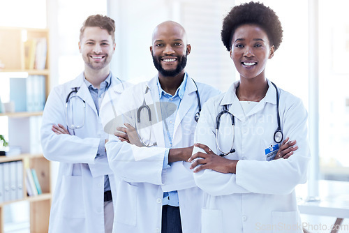 Image of Doctors, team and arms crossed with health, diversity and cardiology, surgeon group collaboration in portrait. Confident, solidarity in cardiovascular healthcare and professional people in medicine