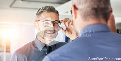 Image of Glasses, choice and senior man, mirror and vision with eyewear in clinic, prescription lens with designer frame. Eyesight, eye care and optometry, healthcare and male person with spectacles decision