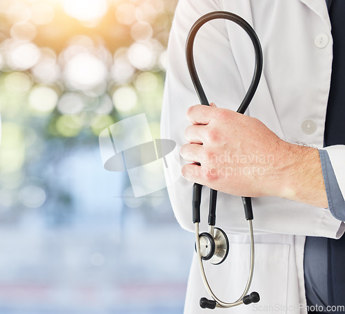 Image of Stethoscope in hand, health and doctor with medical person, cardiology and surgeon in hospital with mockup space. Bokeh, cardiovascular healthcare and professional in clinic with expert in medicine