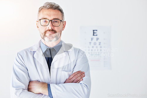 Image of Senior man, arms crossed with optometrist in portrait, vision and glasses, eye care clinic and healthcare. Male person, ophthalmology and health for eyes, eyesight assessment and prescription lens