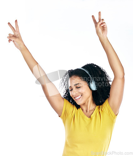 Image of Music, dancing and a woman with headphones and peace sign in studio streaming audio, sound or radio. Energy, happy and a young person isolated on a white background listening to fun song to relax