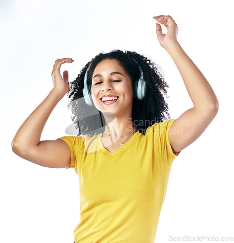 Image of Music, dancing and a woman with headphones in studio streaming audio, sound or radio. Energy, happy and a young female person isolated on a white background listening and moving to fun song to relax