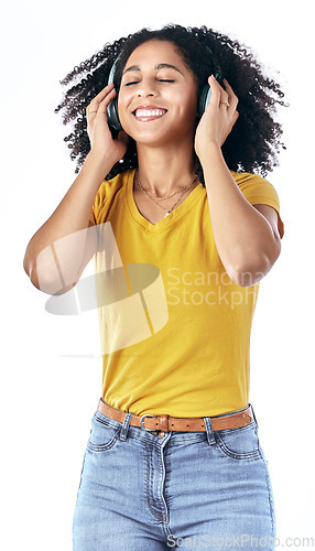 Image of Music, excited and a happy woman with headphones in studio streaming audio, sound or radio. Energy, podcast and a young african person isolated on a white background listening to fun song to relax