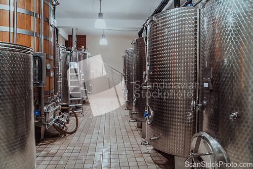 Image of Modern wine distillery and brewery with brew kettles pipes and stainless steel tanks