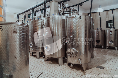 Image of Modern wine distillery and brewery with brew kettles pipes and stainless steel tanks