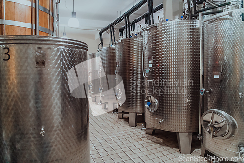 Image of Modern wine distillery and brewery with brew kettles pipes and stainless steel tanks