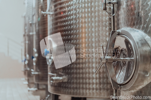 Image of Modern wine distillery and brewery with brew kettles pipes and stainless steel tanks