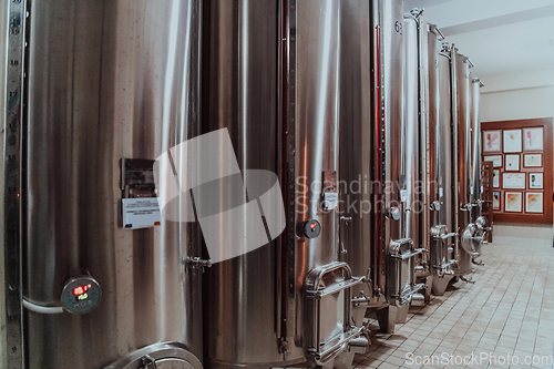 Image of Modern wine distillery and brewery with brew kettles pipes and stainless steel tanks
