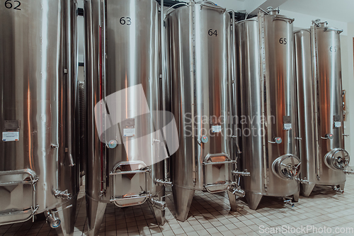 Image of Modern wine distillery and brewery with brew kettles pipes and stainless steel tanks