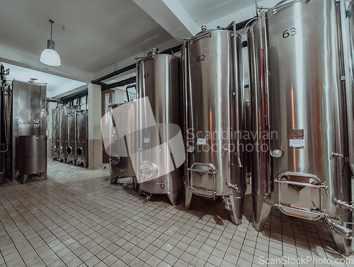 Image of Modern wine distillery and brewery with brew kettles pipes and stainless steel tanks