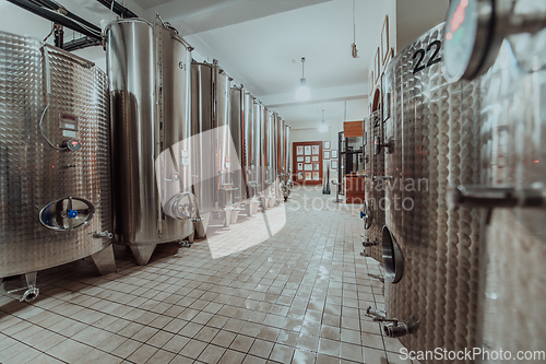 Image of Modern wine distillery and brewery with brew kettles pipes and stainless steel tanks